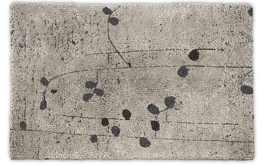 gray area rug with flower pattern