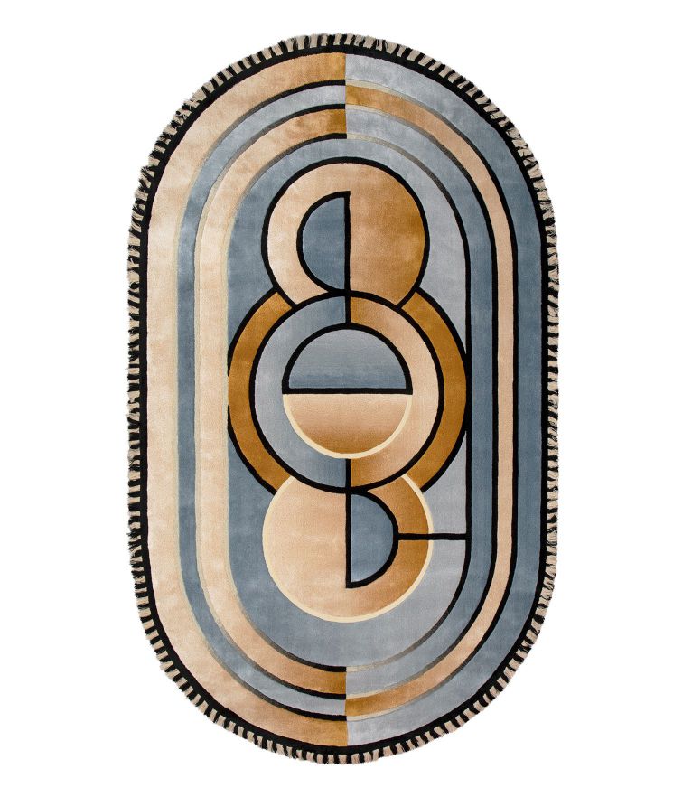 Best Lounge Rugs: colorful lounge rug in orange and blue tones with oval shape