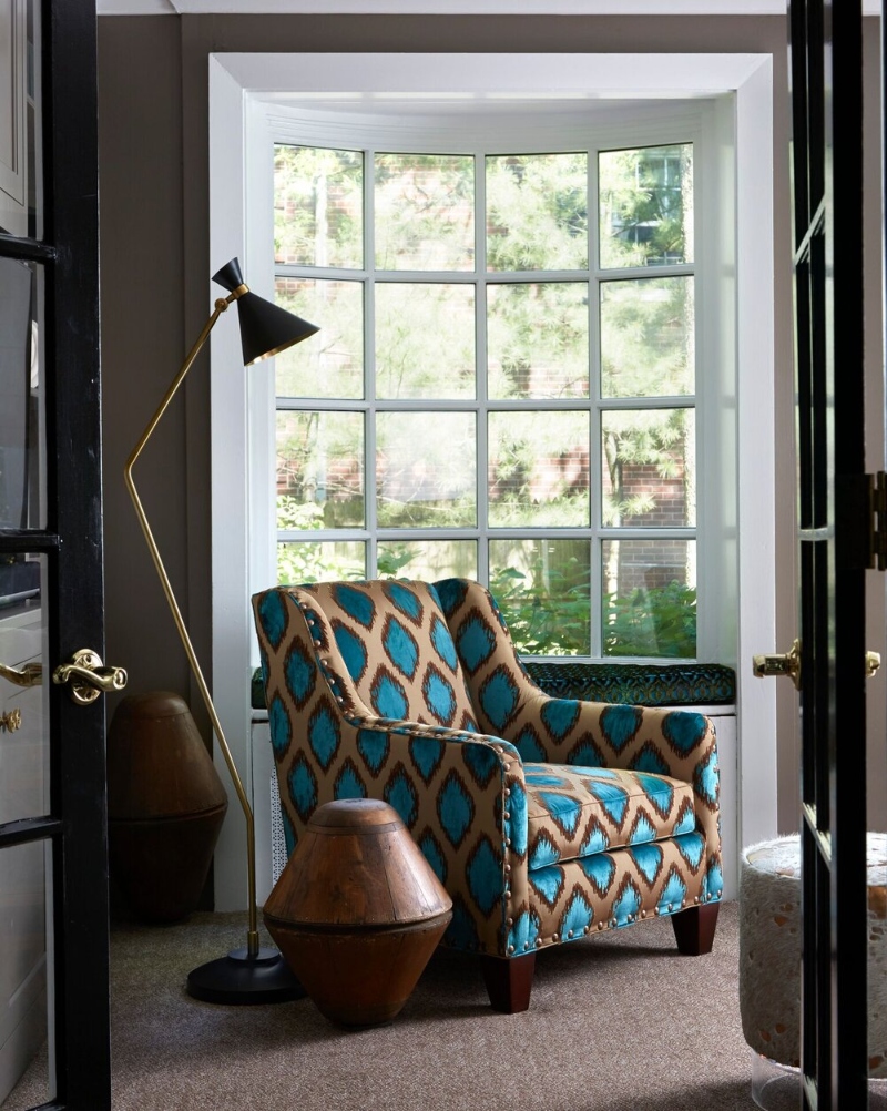 Reading Corner interior design with colorful sofa and neutral rug