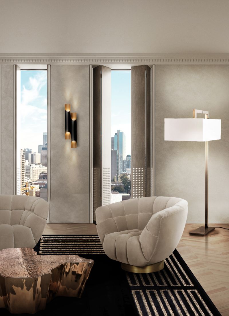 Modern and elegant living room with black and gold area rug, essex armchair and gold center table