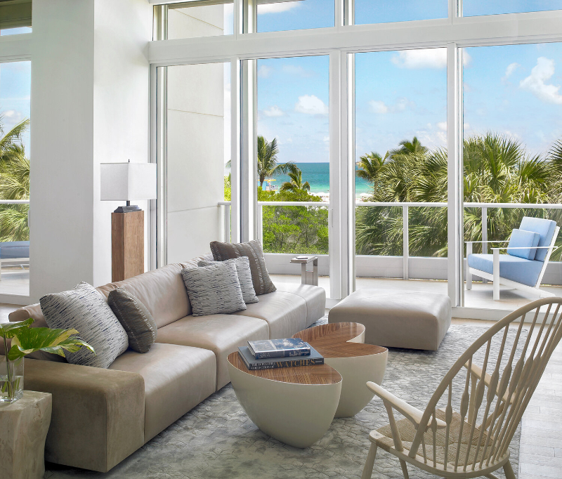Michael Wolk - South Beach Townhouse. Living room in neutral tones with grey rug.