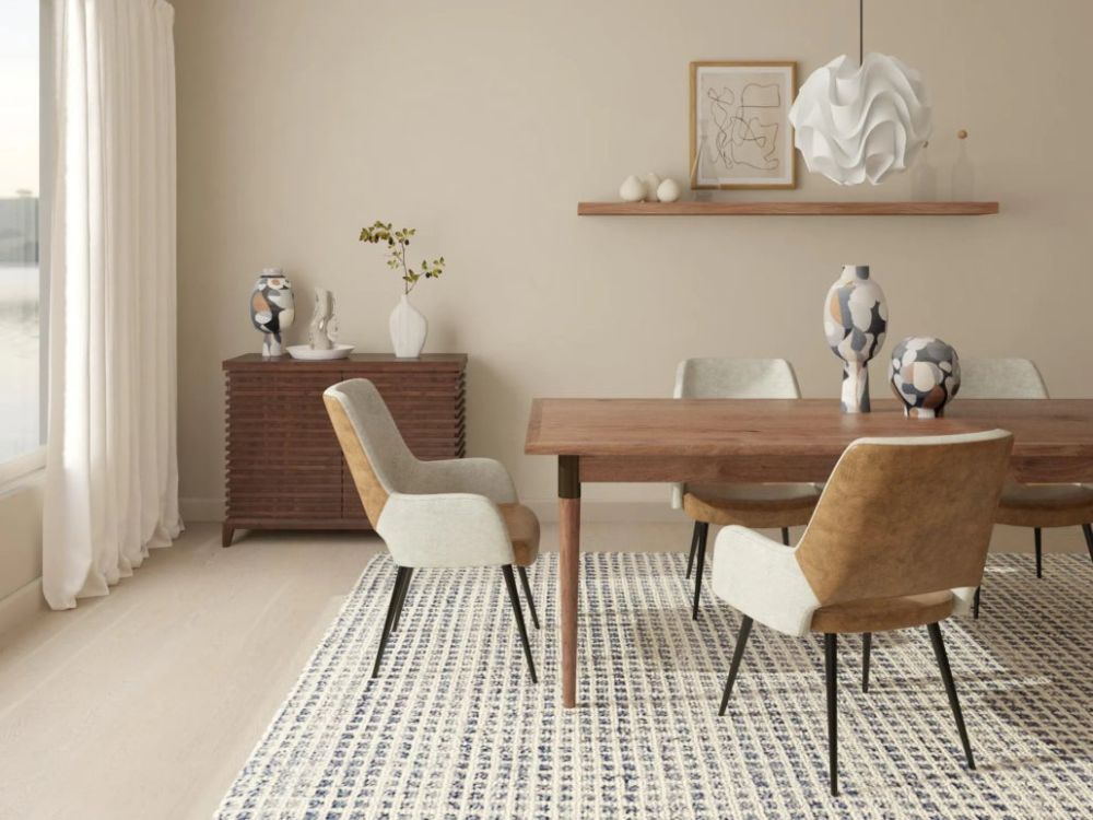 area rugs in Rustic dining room in neutral colors with dining chairs and wooden table.