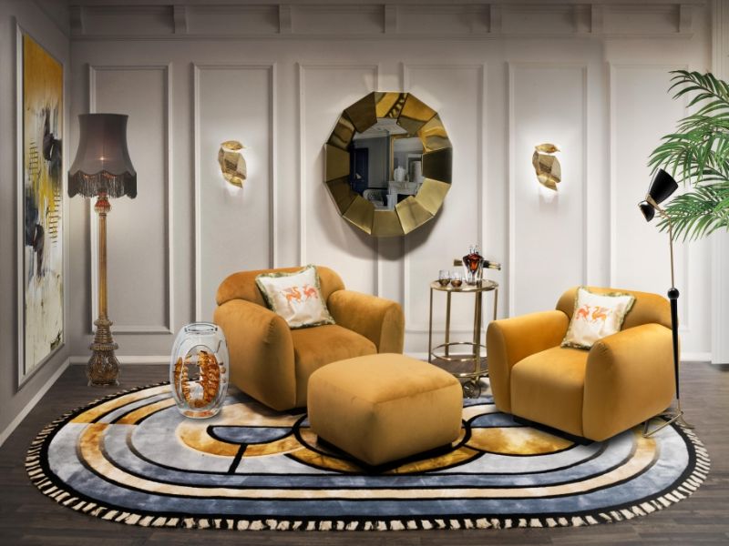 Kleopatra rug in a mid-century living room with bright orange armchairs