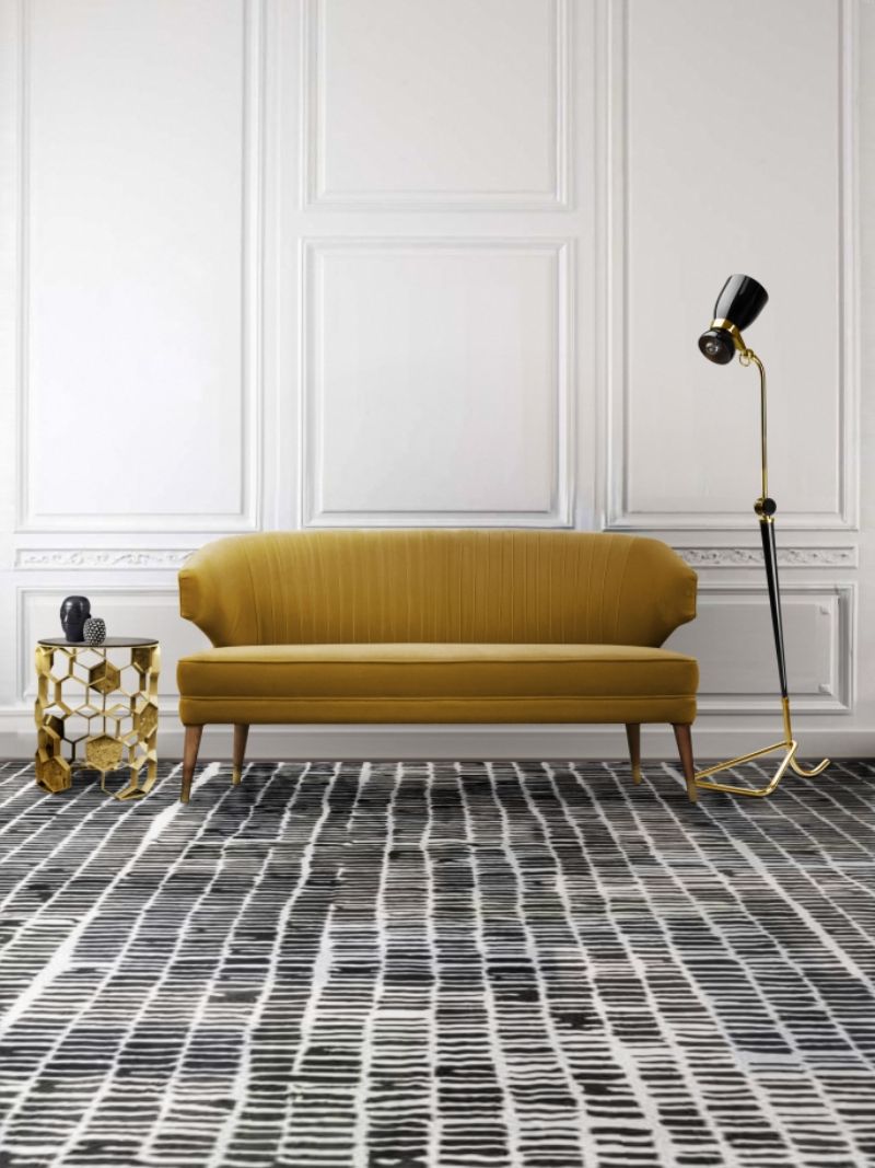 modern mid-century living room with coll rug and orange sofa