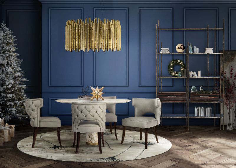 Macushi rug decorates this contemporary dining room with round suspension light and round table with velvet chairs