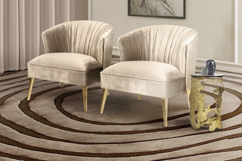 living room corner with eye rug in warmer colors with armchairs and side table