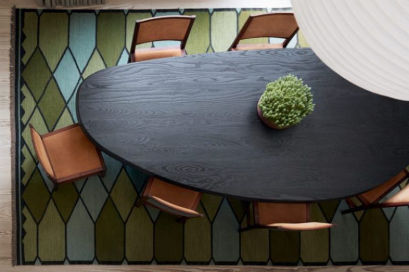 contemporary dining room with colorful rug with a nice pattern. The Best Rugs For Your Dining Room