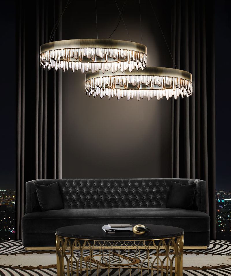 luxurious living room with couple rug and bourbon black velvet sofa with gold round hanging lights