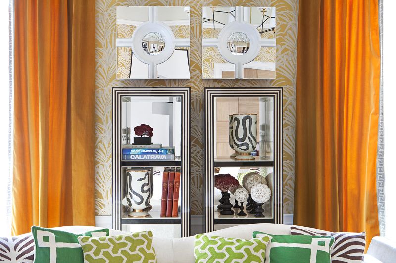 colorful cushions, black and white decorative elements, orange curtains
