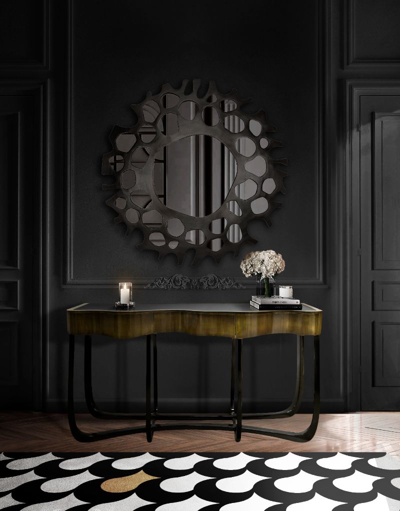 Modern hallway with ADLER RUG in blakc and white with a round pattern, and gray mirror and wooden console. Minimalist Rugs: The Latest Interior Trends