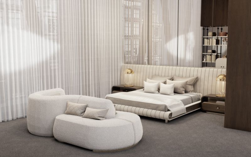 modern midcentury bedroom with gray area rug and white bedframe with white sofa.