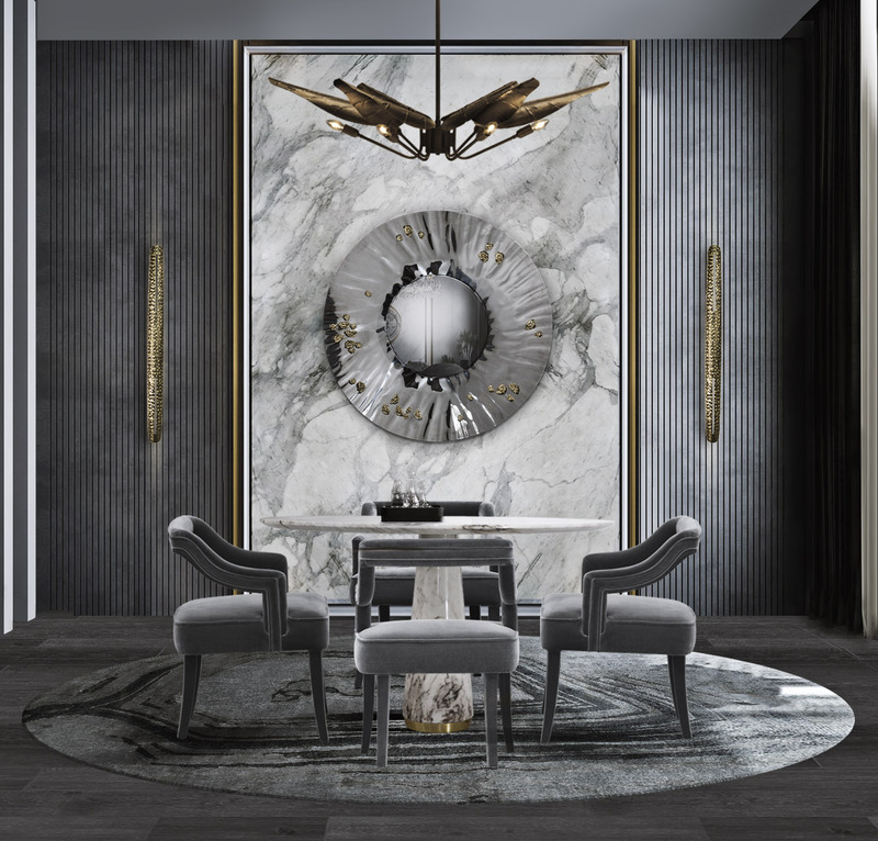 Luxurious dining room with monochrome colors, the round blue rug highlights the dining chairs and the suspension lights. 15 Top Home Decor Ideas For 2022: Classy Modern Rugs For A Timeless Look