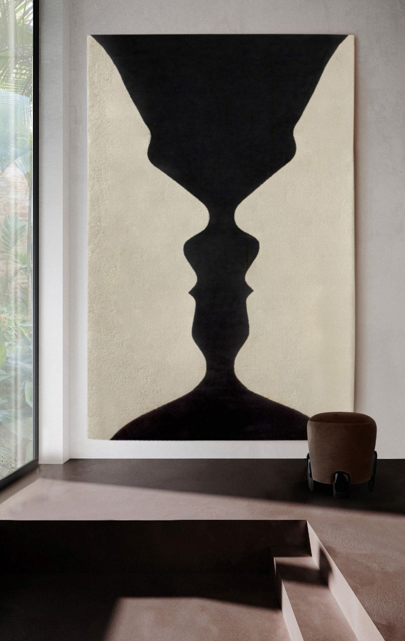 minimalist hallway decor with black and white wall rug, the VASE RUG is a art piece that has an optical illusion.