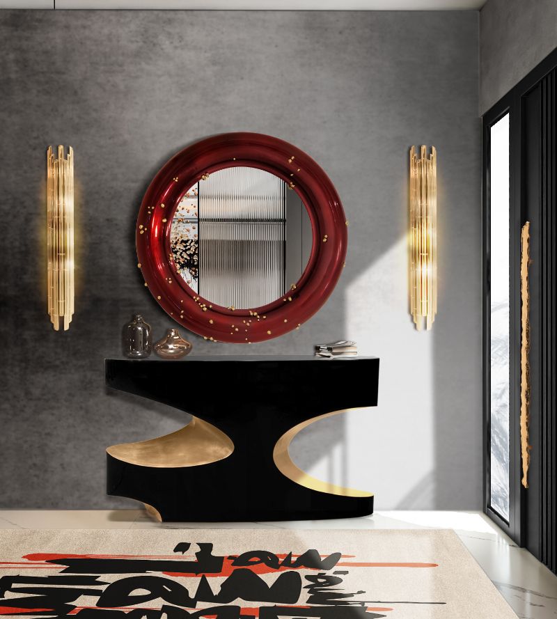 modern entryway with urban rug inspired by street art. elegant console paired with round mirror in red. Rug Trends To Look Out For In 2022