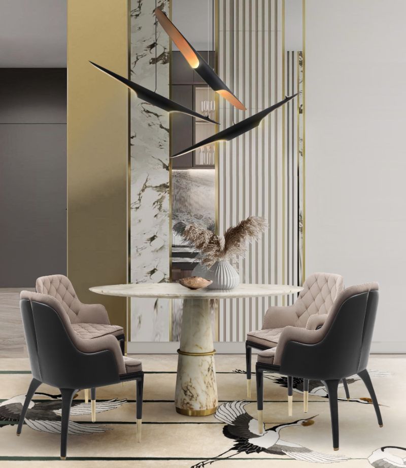 Small dining room with beige area rug with heron birds in the rug design. Luxurious Dining Room Ideas With Rugs