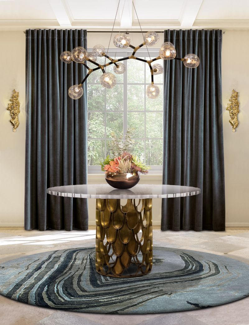 modern classic entryway with a round blue rug that decorates the floors and a round table with suspension lights. The Most Exquisite Interiors Inspiration
