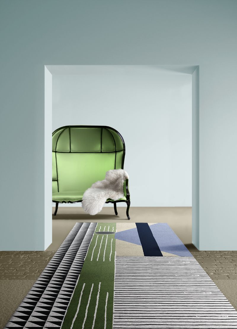 Contemporary hallway with colorful rug  with different geometric designs and tones of blue and green.