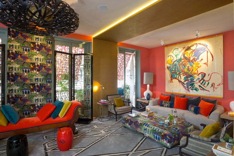 living room by Carrillo Proyectos with colorful cushions