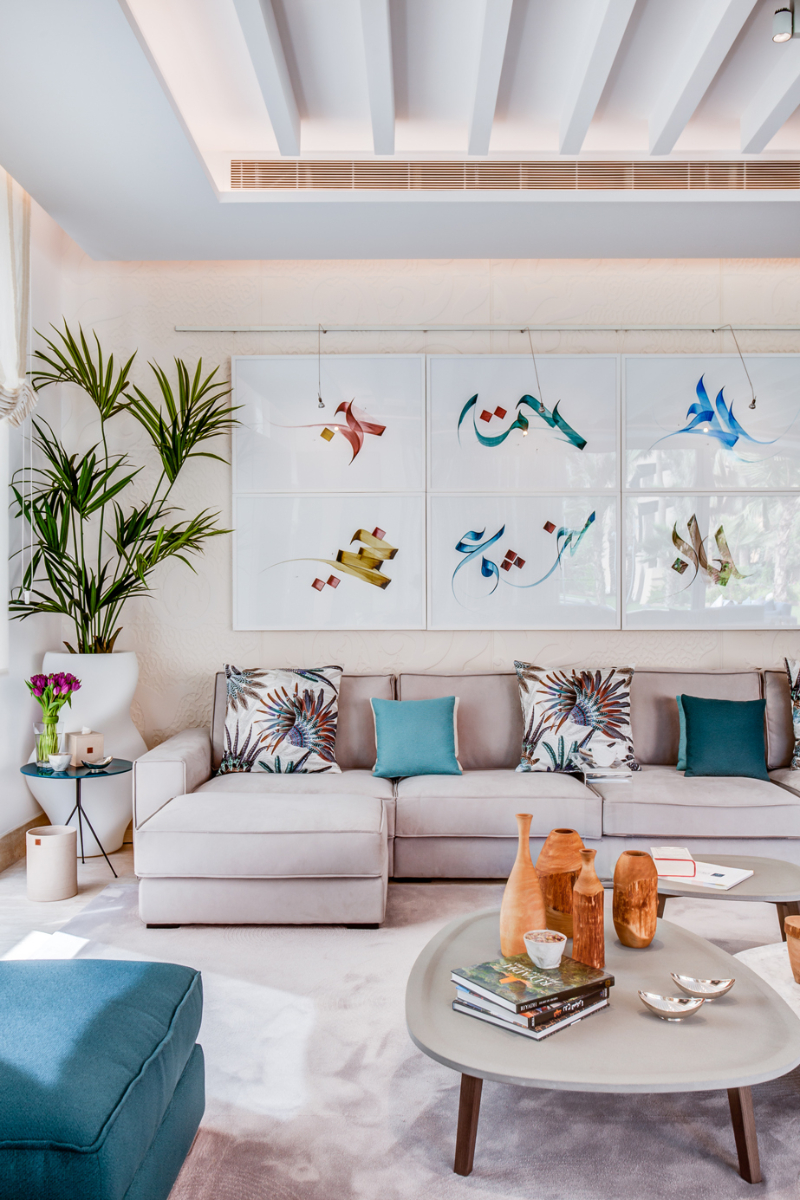 living room by Carrillo Proyectos with clear colors and blue accents