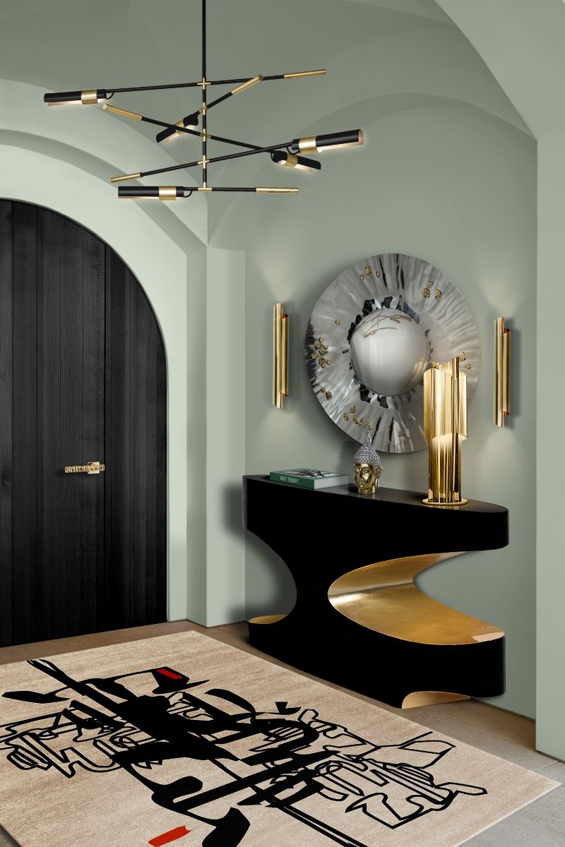 ISaloni 2022: New Furniture and Design Ideas. Modern hallway interior with a urban rug in black and white paired with black and golden console and gray round mirror.