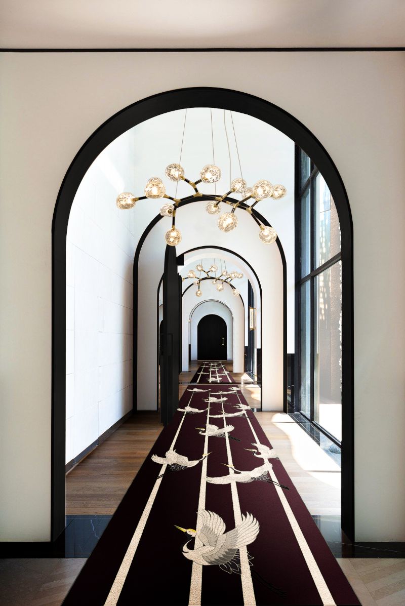 ISaloni 2022: New Furniture and Design Ideas: Long hallway with a stunning runner rug with heron bird design in dark hues and with suspension lights