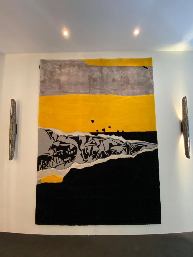 iSaloni Fair: Black and yellow rug inspired by street art and reflect revolution and rebellion exposing at Salone del mobile 2022