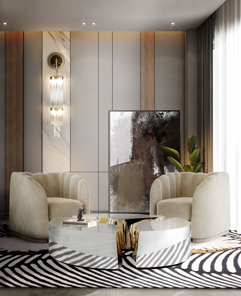 living room rug inspiration for contemporary area with black and white rug and center table with beige armchairs.