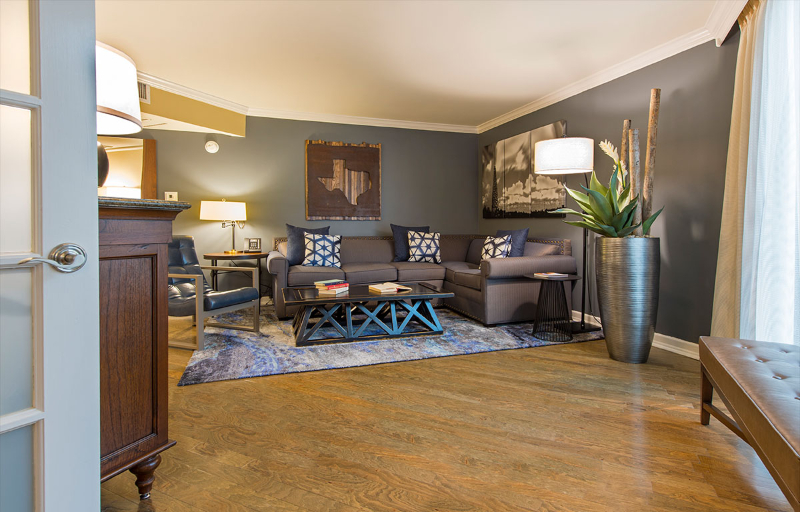 Rug Design Inspiration From Duncan & Miller Design. A wide rug on the seating area of the living room, its colors are gray and green tones.