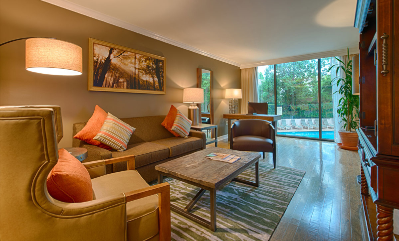 Rug Design Inspiration From Duncan & Miller Design. A gray and green rug on the seating area of the living room.