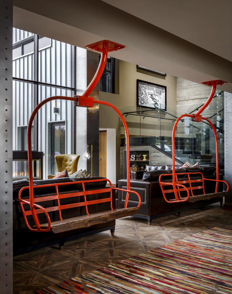 Rug Design Inspiration From Duncan & Miller Design. In this living area there are two swings, under the swings there's a colorful rug.