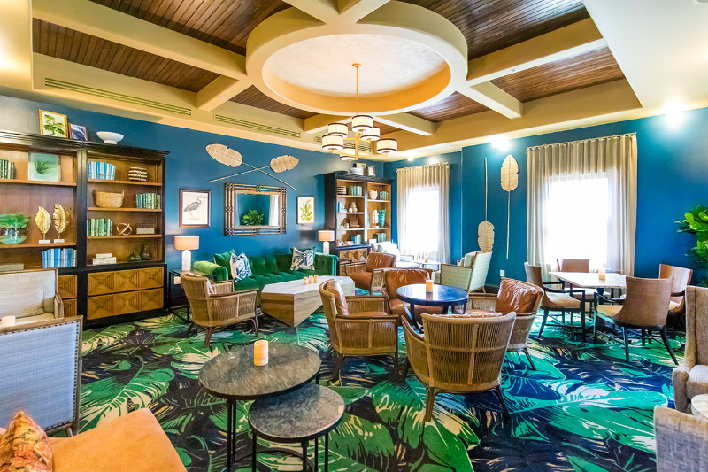 Rug Design Inspiration From Duncan & Miller Design. A colorful rug, blue with green leaves, covering the whole living room.