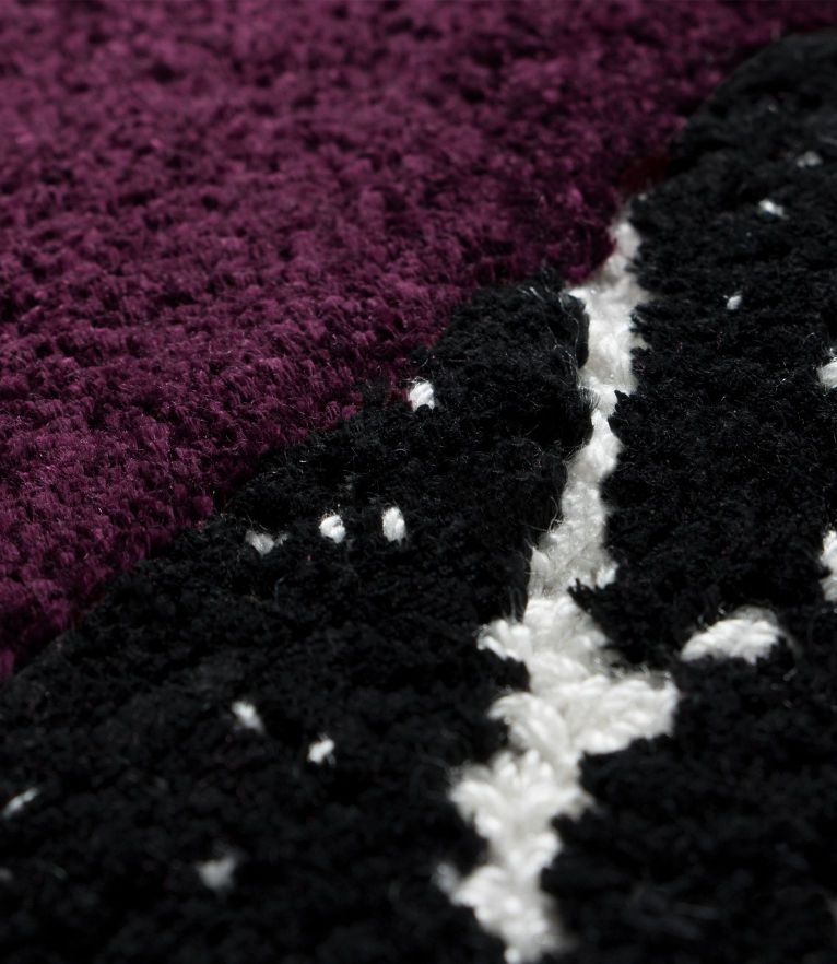 soft wool fluffy rugs with pink and red hues. The snake 8 rug is perfect for the winter