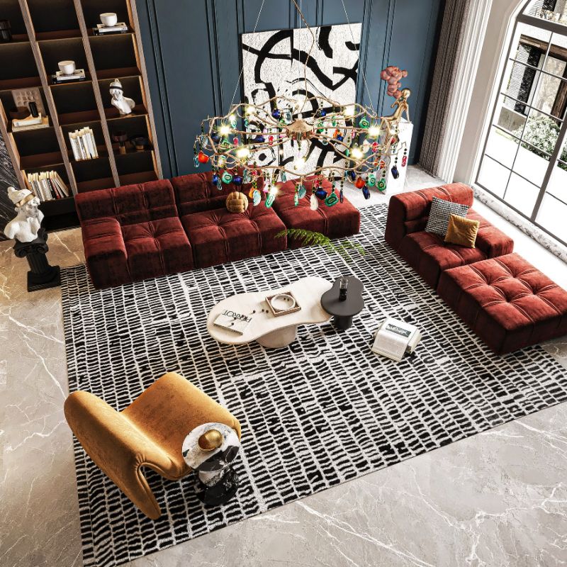 Interior Design Trends For 2023 With New Trend Rooms Ebook. Black and white rug with warm furniture in tones of red and orange
